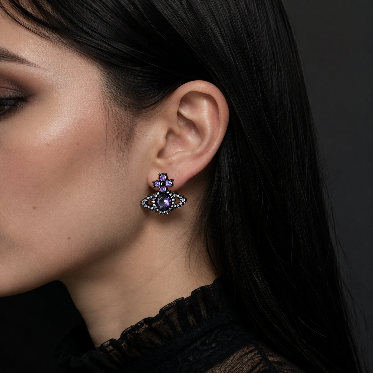 Model wearing a gothic purple cross orb stud earring in 925 sterling silver