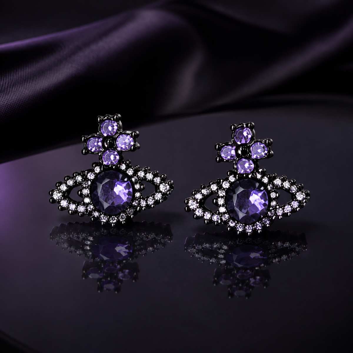 Purple cross orb sterling silver earrings displayed on a reflective dark surface